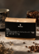 Кава мелена Brazil Santos (Black Edition) 250 г: пачка з чорною етикеткою the box серед кавових зерен