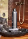 Гель-піна для душу Rituals The Ritual Of Homme 200 мл: сірий балончик на кам'яній чаші біля душу