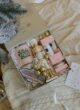Бокс JINGLE BELLS: біла коробка з чашкою Jingle Bells, лускунчиком, набором Rituals і золотими кульками на пледі
