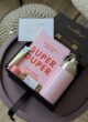 Бокс SPRING VIBE: чорна коробка з блокнотом SUPER DUPER, рожевою пляшкою, кремом і батончиком, листівка Happy Birthday