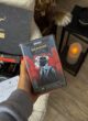 Бокс PLAY TIME: колода гри «Мафія» в руці біля свічки-ліхтарика
