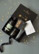 Бокс MIDNIGHT CARE: коробка з набором догляду серед золотих зірочок, здалеку