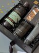 Бокс MIDNIGHT CARE: пляшка гелю для душу та свічка в чорному наповнювачі під кутом