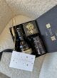 BLACK GOLD згори: бренді St-Remy, шоколад Willie's Cacao, чорна банка й листівка Congratulations із зірками