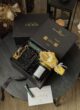 CRYSTAL GLAM на круглому столі: відкрита коробка THE BOX, зелений тюбик і листівка Happy Birthday