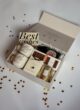 Бокс MARRY ME: відкрита коробка на білому столі, розсипані золоті сердечка