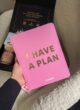 Бокс SELF LOVE KIT: рожевий планер I have a plan у руці над коробкою