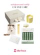 Склад подарункового набору CALM & CARE на білому тлі: коробка THE BOX, свічка, шоколад, блиск і сіль для ванни