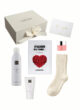 Склад боксу CUPID LOVE на білому тлі: коробка, маска Hyaluron Vita Toning, піна Rituals, крем, бальзам і шкарпетки
