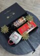 Бокс GLINTWINE BOX згори на сірому столі із золотими сніжинками та чорною стрічкою