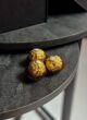 CHERRY LADY: три цукерки Ferrero Rocher на темному кам'яному столі