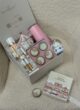 Бокс PINK X-MAS: коробка з відкритим набором свічок, поруч окрема свічка